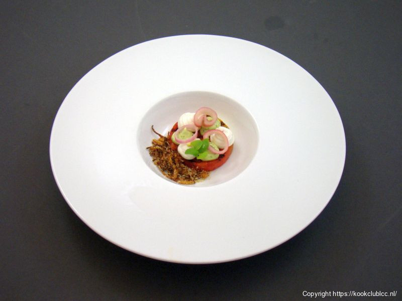 Hapje van gegrilde watermeloen met een crème van geitenkaas